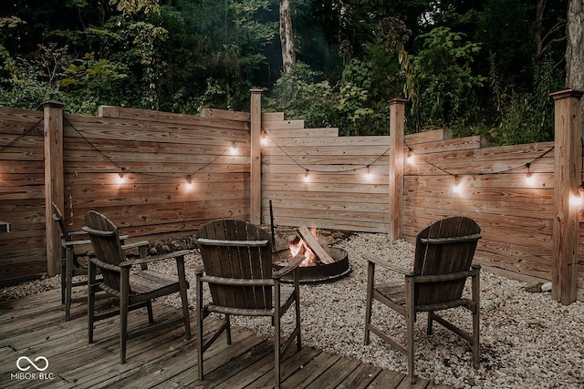 wooden deck featuring a fire pit