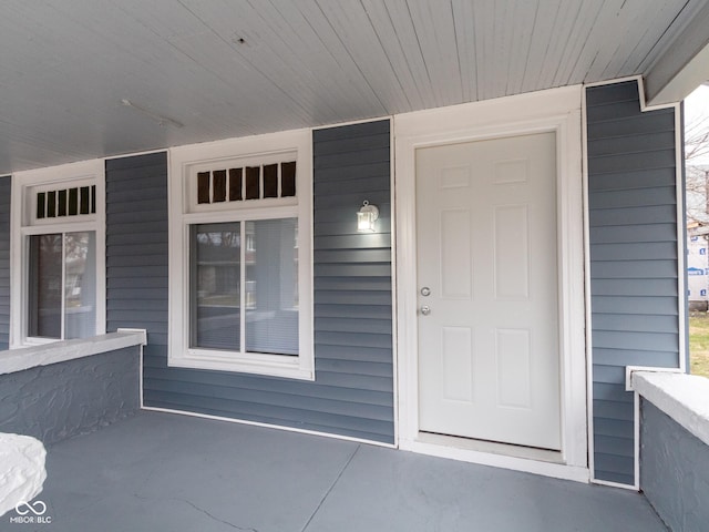 property entrance featuring a porch