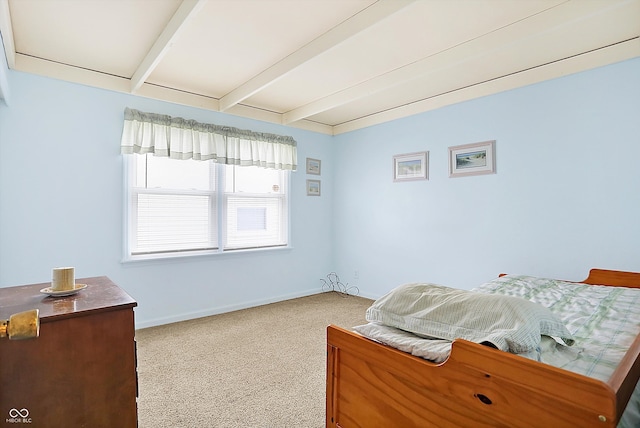 bedroom featuring carpet, beamed ceiling, and baseboards