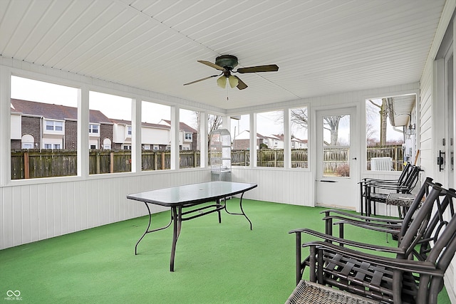 sunroom / solarium with ceiling fan