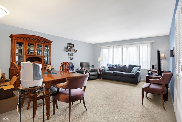 dining room featuring light carpet