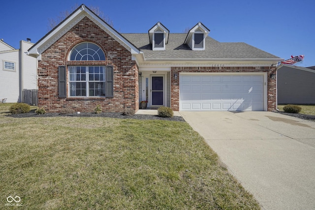 view of front of home with brick siding, a front lawn, roof with shingles, a garage, and driveway