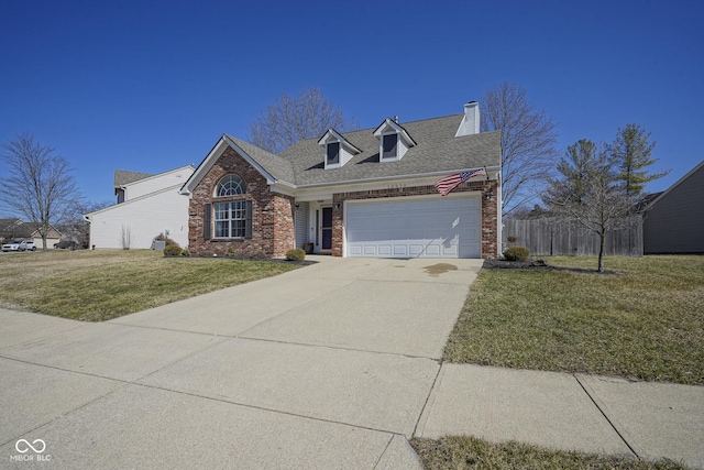 view of front of house featuring brick siding, an attached garage, fence, a front yard, and driveway