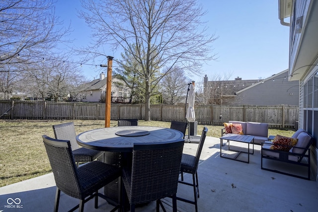 view of patio with outdoor dining area and a fenced backyard