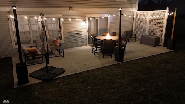 patio at night with an outdoor fire pit