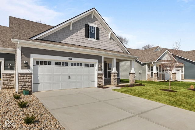 craftsman house with concrete driveway, an attached garage, stone siding, a front lawn, and a shingled roof