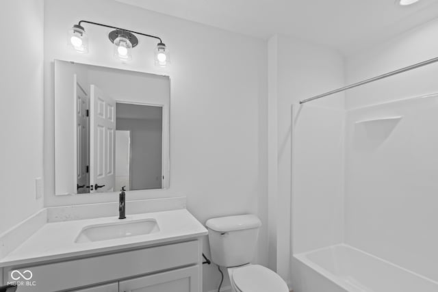 full bath featuring bathtub / shower combination, toilet, and vanity