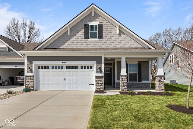 craftsman house featuring stone siding, concrete driveway, a garage, a front lawn, and a porch