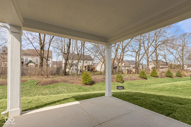 view of patio / terrace featuring a residential view and fence