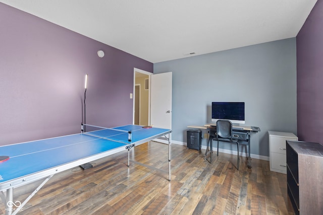 game room featuring visible vents, baseboards, and hardwood / wood-style flooring