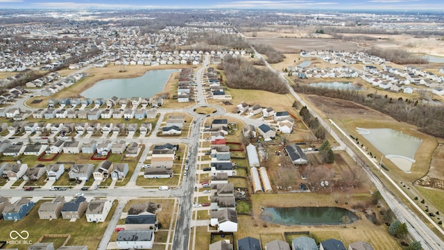 bird's eye view featuring a residential view and a water view