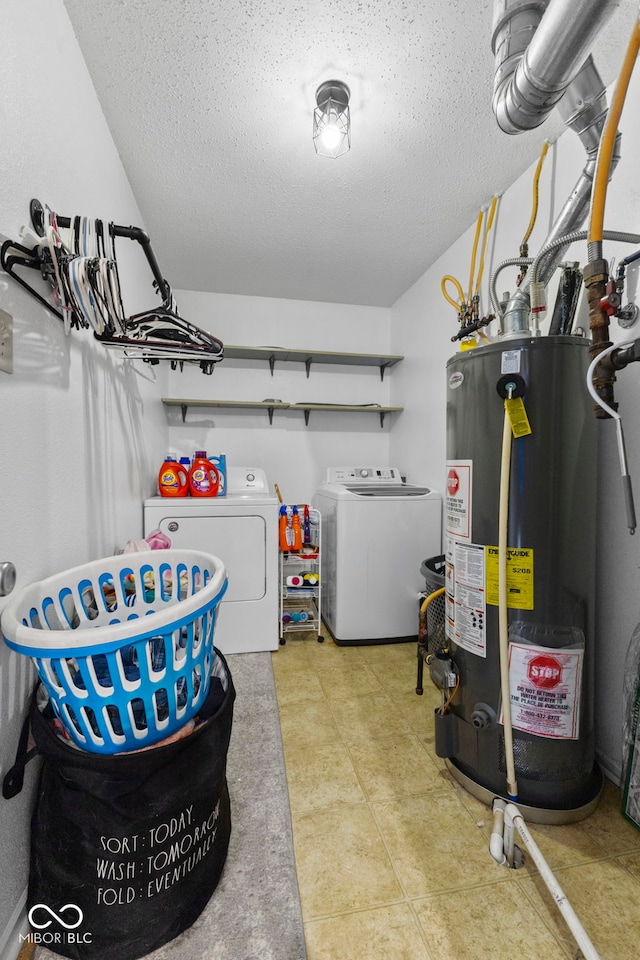 interior space with washer and dryer, gas water heater, and a textured ceiling