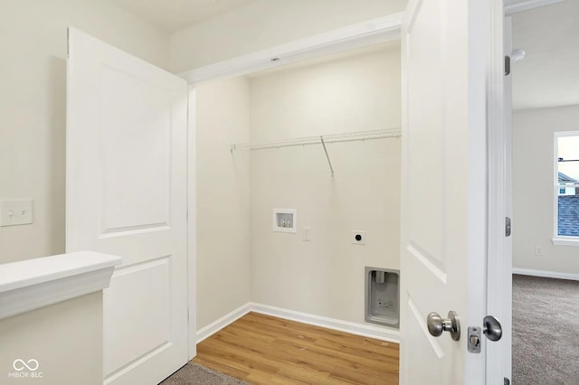 laundry room featuring laundry area, baseboards, light wood-style flooring, hookup for a washing machine, and hookup for an electric dryer