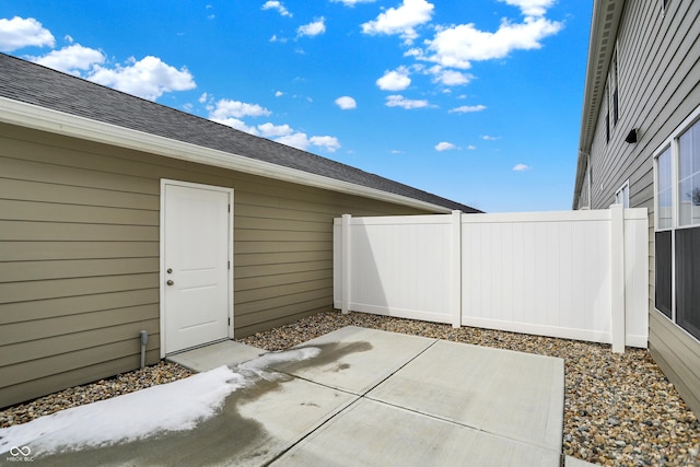 view of patio featuring fence