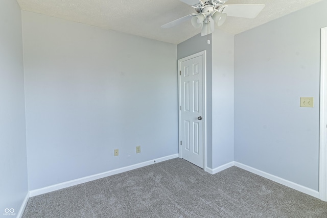 unfurnished room featuring a ceiling fan, carpet, baseboards, and a textured ceiling