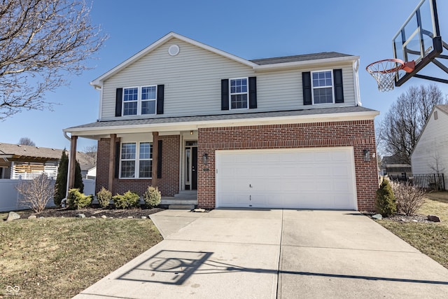 traditional home with a garage, concrete driveway, brick siding, and fence