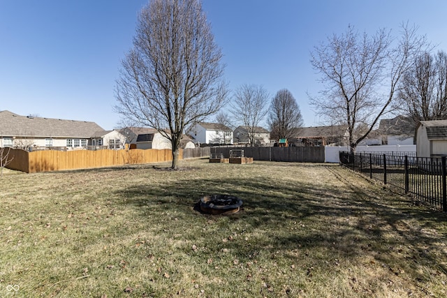 view of yard with a residential view and fence