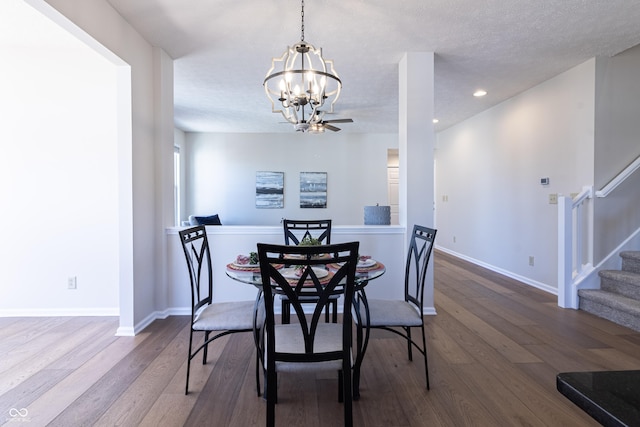 dining room with recessed lighting, stairway, baseboards, and wood finished floors