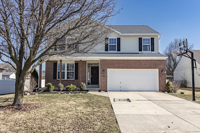 traditional-style home featuring an attached garage, fence, concrete driveway, and brick siding