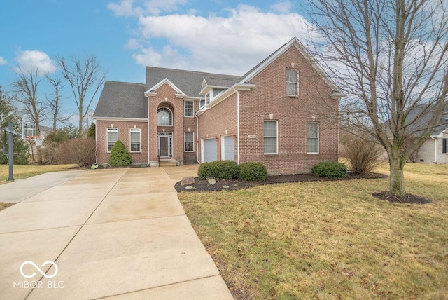 traditional-style home featuring brick siding, concrete driveway, and a front yard