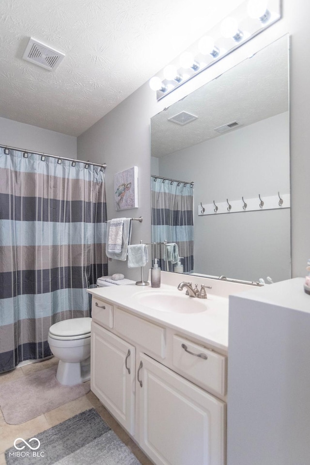 full bath with a textured ceiling, toilet, vanity, and visible vents