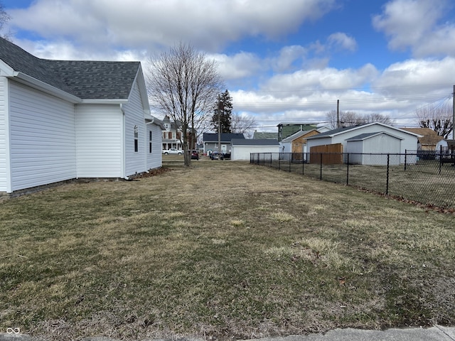 view of yard with fence and a residential view