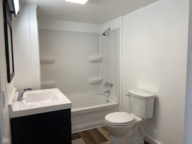 full bathroom with toilet, shower / tub combination, wood finished floors, and vanity