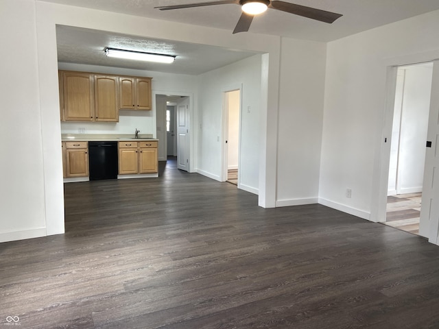 kitchen with baseboards, dishwasher, ceiling fan, dark wood-type flooring, and light countertops