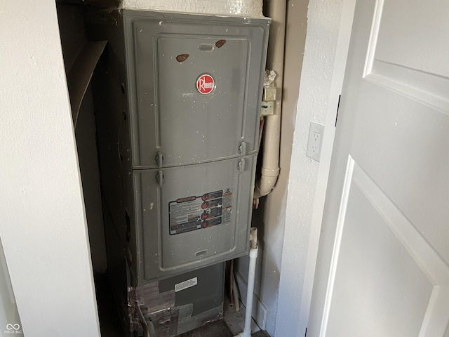 utility room featuring heating unit