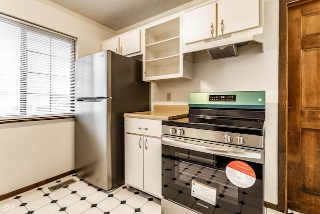 kitchen featuring visible vents, appliances with stainless steel finishes, light floors, a textured ceiling, and under cabinet range hood