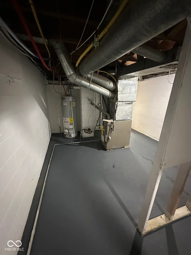 utility room with heating unit and gas water heater