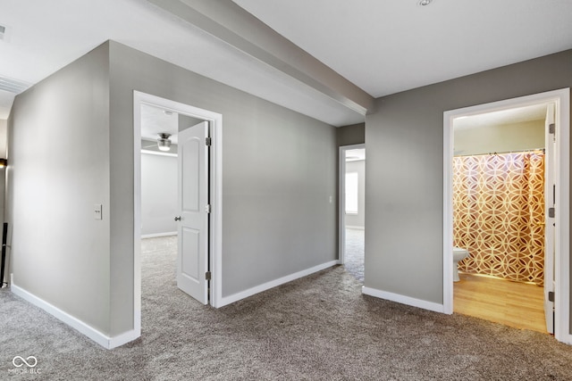 unfurnished bedroom featuring carpet, visible vents, and baseboards