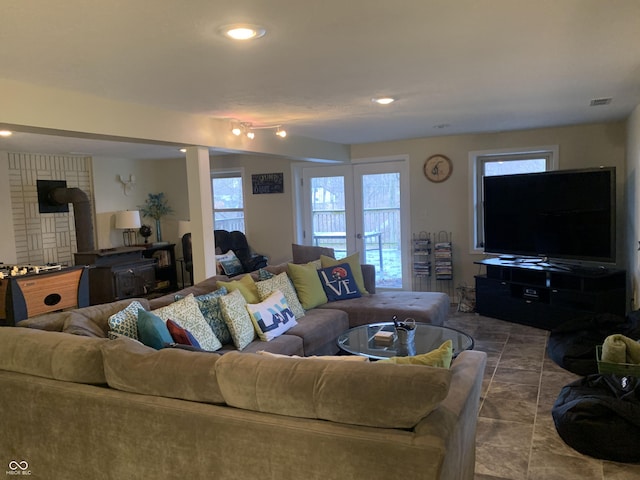 living area with recessed lighting and visible vents