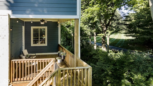 wooden deck with a ceiling fan