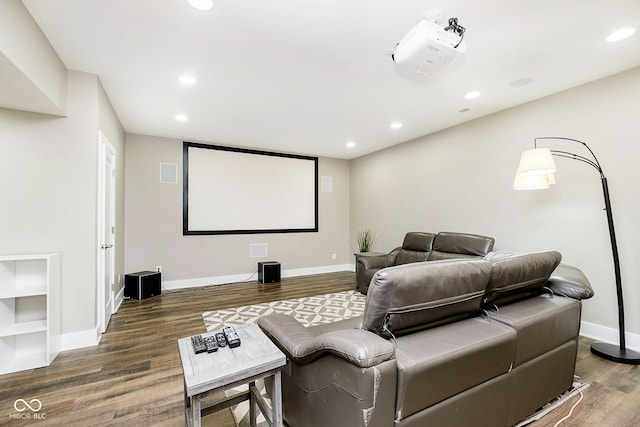 cinema room featuring recessed lighting, wood finished floors, and baseboards