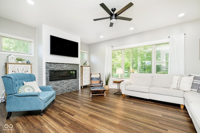 living room with ceiling fan, recessed lighting, wood finished floors, and a fireplace