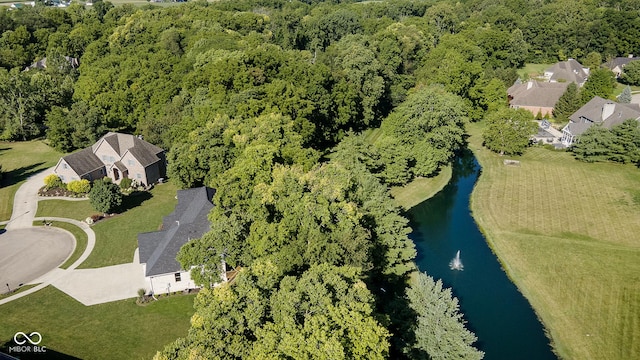 bird's eye view with a wooded view and a water view