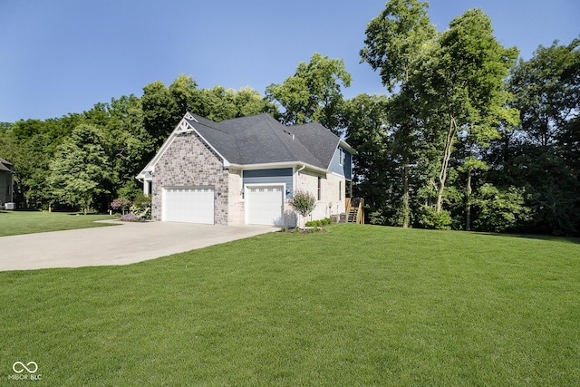 view of front of home featuring a front lawn, brick siding, a garage, and driveway