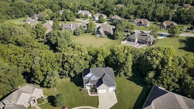 aerial view with a forest view and a residential view