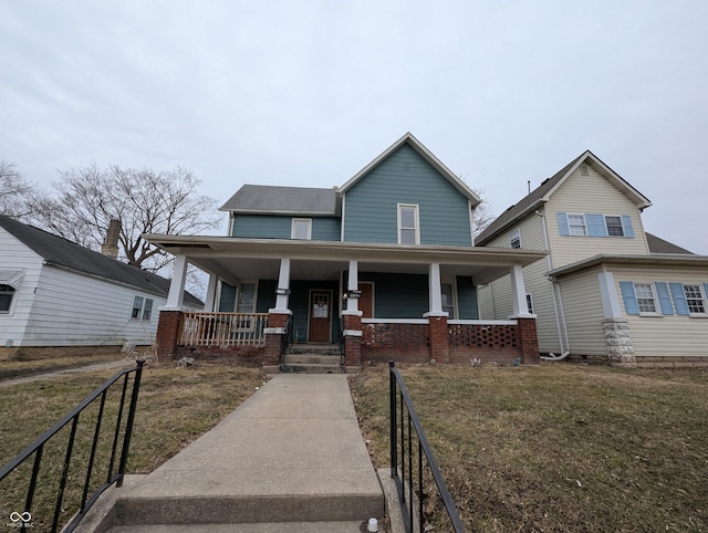 view of front of property featuring a porch and a front yard