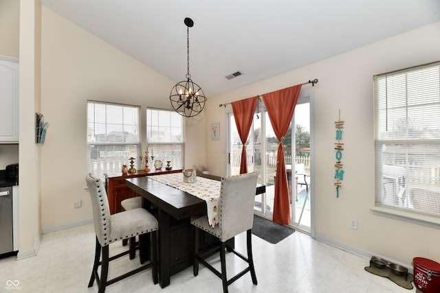 dining area with lofted ceiling, light floors, visible vents, and an inviting chandelier