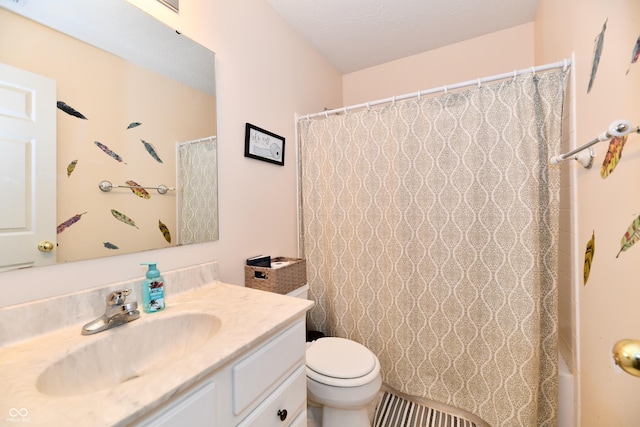 bathroom with toilet, a shower with shower curtain, and vanity