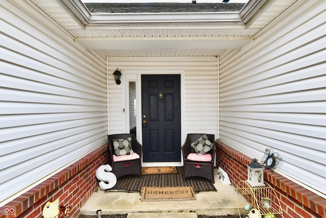 entrance to property with brick siding