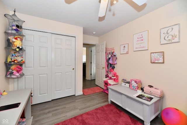 game room with wood finished floors and a ceiling fan