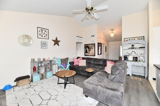 living room featuring high vaulted ceiling, wood finished floors, and a ceiling fan