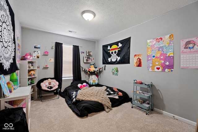 bedroom featuring baseboards, carpet flooring, visible vents, and a textured ceiling