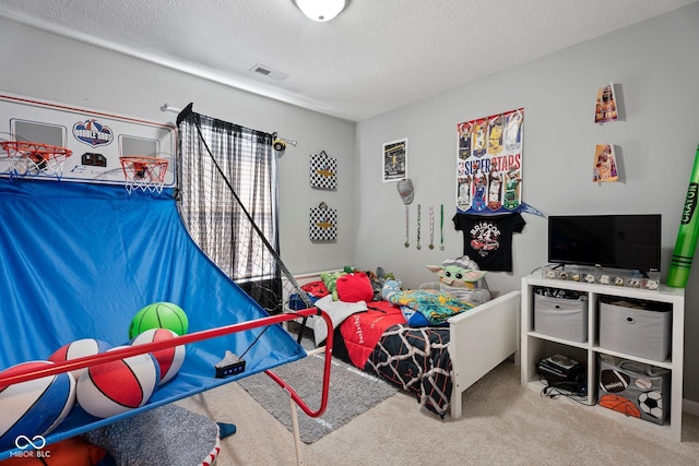 carpeted bedroom featuring visible vents and a textured ceiling