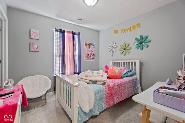 carpeted bedroom featuring multiple windows and visible vents