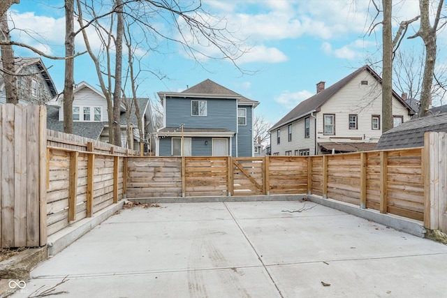 view of patio with a fenced backyard and a residential view