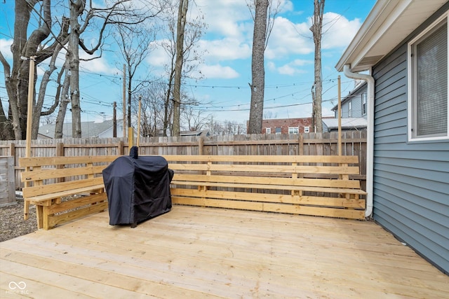 deck featuring a fenced backyard and area for grilling